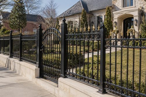 Black ornamental aluminum fence along a front yard in Pendleton, SC
